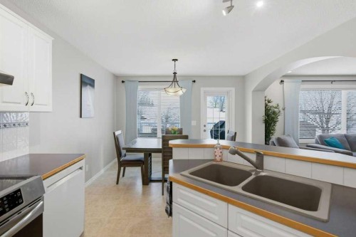 34 Arbour Stone Rise Nw, Calgary, AB - Indoor Photo Showing Kitchen With Double Sink