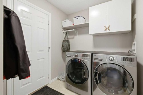 34 Arbour Stone Rise Nw, Calgary, AB - Indoor Photo Showing Laundry Room