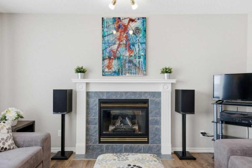 34 Arbour Stone Rise Nw, Calgary, AB - Indoor Photo Showing Living Room With Fireplace