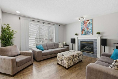 34 Arbour Stone Rise Nw, Calgary, AB - Indoor Photo Showing Living Room With Fireplace