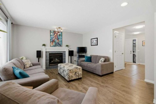 34 Arbour Stone Rise Nw, Calgary, AB - Indoor Photo Showing Living Room With Fireplace