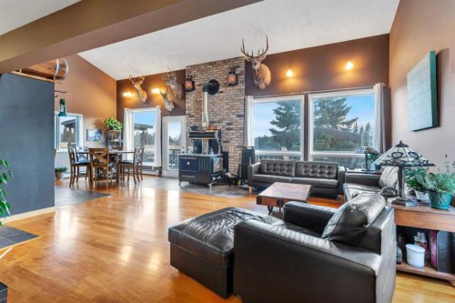 31442 Range Road 45, Rural Mountain View County, AB - Indoor Photo Showing Living Room With Fireplace