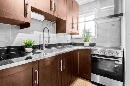 8-3726 Centre Street Ne, Calgary, AB - Indoor Photo Showing Kitchen With Double Sink With Upgraded Kitchen