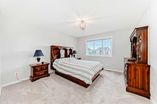 151 Sundown Way, Cochrane, AB - Indoor Photo Showing Bedroom