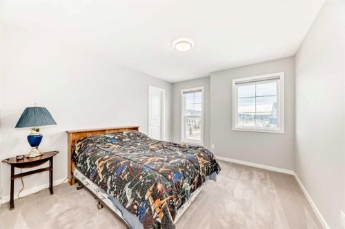151 Sundown Way, Cochrane, AB - Indoor Photo Showing Bedroom
