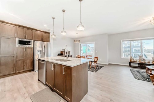 151 Sundown Way, Cochrane, AB - Indoor Photo Showing Kitchen With Upgraded Kitchen