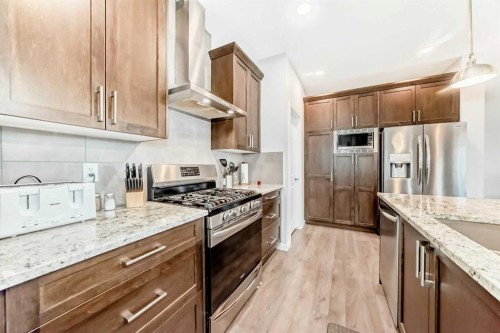 151 Sundown Way, Cochrane, AB - Indoor Photo Showing Kitchen With Upgraded Kitchen