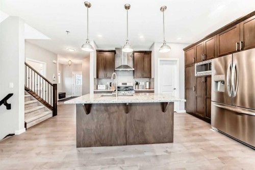 151 Sundown Way, Cochrane, AB - Indoor Photo Showing Kitchen With Upgraded Kitchen