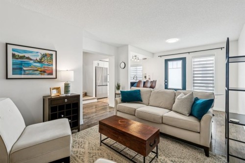321 Windstone Gardens Sw, Airdrie, AB - Indoor Photo Showing Living Room