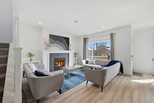 1153 Kingston Crescent Se, Airdrie, AB - Indoor Photo Showing Living Room With Fireplace