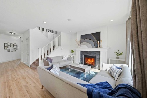 1153 Kingston Crescent Se, Airdrie, AB - Indoor Photo Showing Living Room With Fireplace