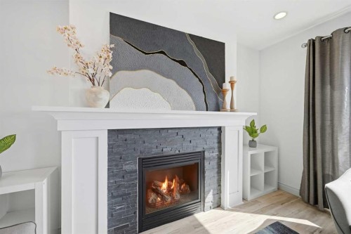 1153 Kingston Crescent Se, Airdrie, AB - Indoor Photo Showing Living Room With Fireplace