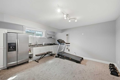1153 Kingston Crescent Se, Airdrie, AB - Indoor Photo Showing Gym Room