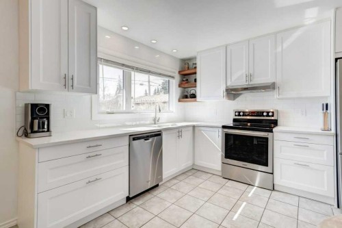 81 Healy Drive Sw, Calgary, AB - Indoor Photo Showing Kitchen With Stainless Steel Kitchen
