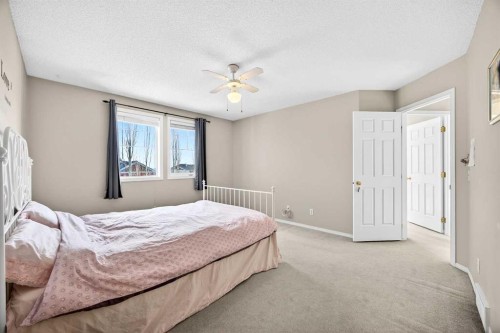 287 Panamount Drive Nw, Calgary, AB - Indoor Photo Showing Bedroom