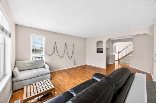 287 Panamount Drive Nw, Calgary, AB - Indoor Photo Showing Living Room