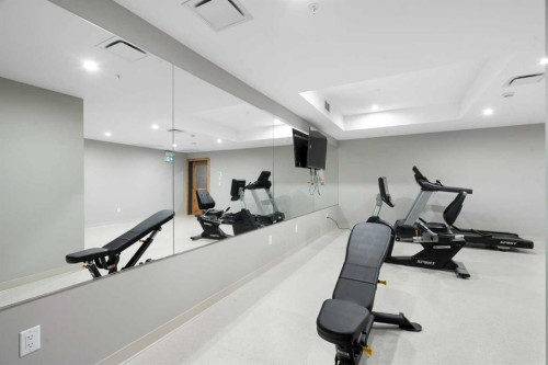 402-1505 Spring Creek Gate, Canmore, AB - Indoor Photo Showing Gym Room