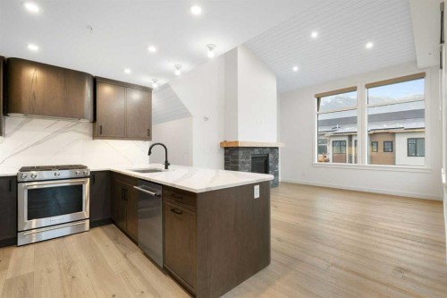 402-1505 Spring Creek Gate, Canmore, AB - Indoor Photo Showing Kitchen With Upgraded Kitchen