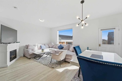 233 Copperleaf Way Se, Calgary, AB - Indoor Photo Showing Other Room With Fireplace