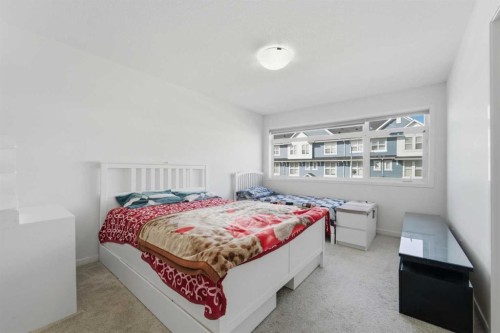 233 Copperleaf Way Se, Calgary, AB - Indoor Photo Showing Bedroom