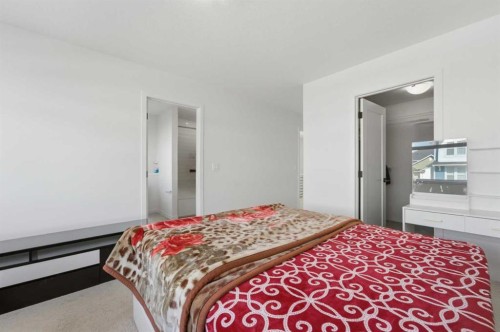 233 Copperleaf Way Se, Calgary, AB - Indoor Photo Showing Bedroom