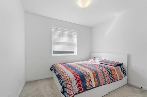 233 Copperleaf Way Se, Calgary, AB - Indoor Photo Showing Bedroom
