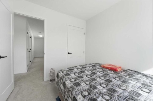 233 Copperleaf Way Se, Calgary, AB - Indoor Photo Showing Bedroom
