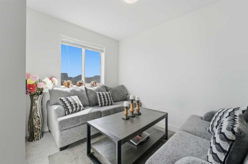 233 Copperleaf Way Se, Calgary, AB - Indoor Photo Showing Living Room