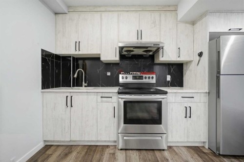 233 Copperleaf Way Se, Calgary, AB - Indoor Photo Showing Kitchen With Stainless Steel Kitchen With Upgraded Kitchen