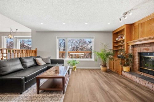 412 Hawkland Place Nw, Calgary, AB - Indoor Photo Showing Living Room With Fireplace