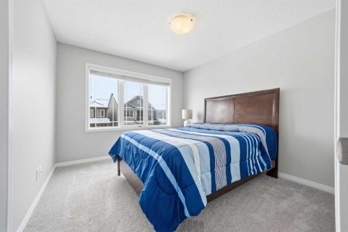 134 Windrow Link Sw, Airdrie, AB - Indoor Photo Showing Bedroom