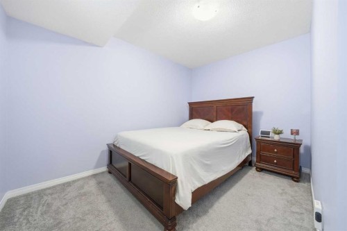 134 Windrow Link Sw, Airdrie, AB - Indoor Photo Showing Bedroom
