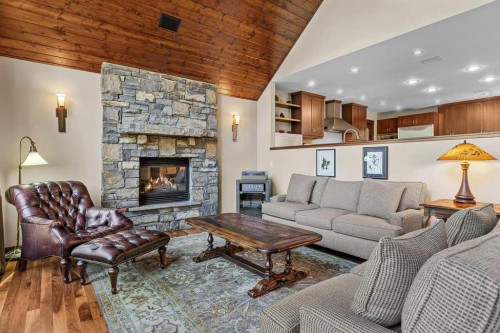 16 Blue Grouse Ridge, Canmore, AB - Indoor Photo Showing Living Room With Fireplace