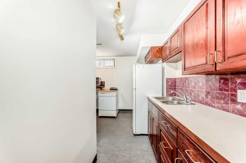 1415 Rosehill Drive Nw, Calgary, AB - Indoor Photo Showing Kitchen With Double Sink