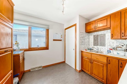 1415 Rosehill Drive Nw, Calgary, AB - Indoor Photo Showing Kitchen With Double Sink