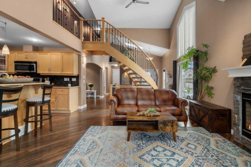173 Cimarron Park Circle, Okotoks, AB - Indoor Photo Showing Other Room With Fireplace