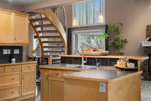 173 Cimarron Park Circle, Okotoks, AB - Indoor Photo Showing Kitchen With Double Sink