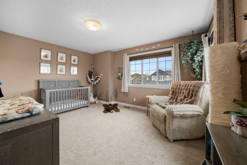 173 Cimarron Park Circle, Okotoks, AB - Indoor Photo Showing Bedroom