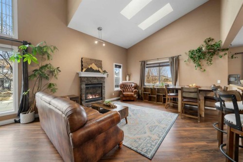 173 Cimarron Park Circle, Okotoks, AB - Indoor Photo Showing Living Room With Fireplace