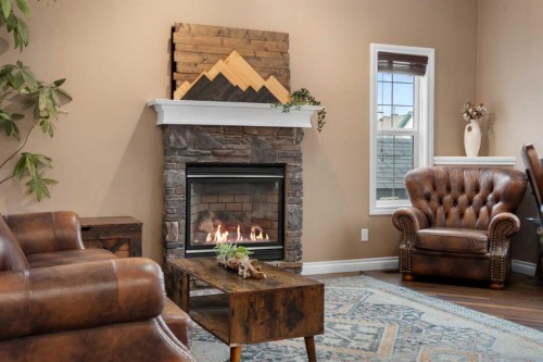 173 Cimarron Park Circle, Okotoks, AB - Indoor Photo Showing Living Room With Fireplace