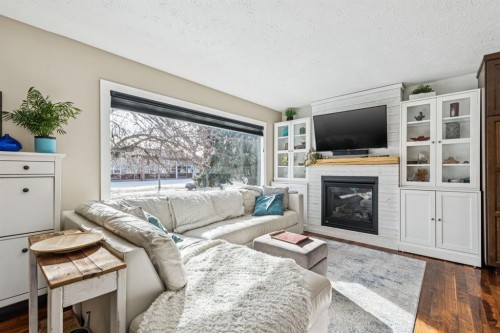 56 Haddock Road Sw, Calgary, AB - Indoor Photo Showing Living Room With Fireplace