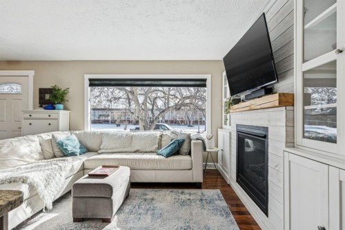 56 Haddock Road Sw, Calgary, AB - Indoor Photo Showing Living Room With Fireplace
