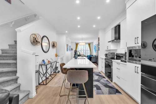 52 Edith Gate Nw, Calgary, AB - Indoor Photo Showing Kitchen With Upgraded Kitchen