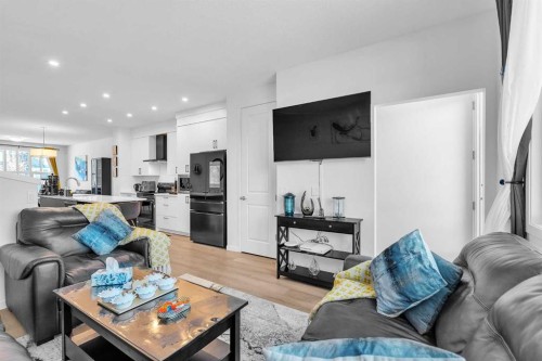 52 Edith Gate Nw, Calgary, AB - Indoor Photo Showing Living Room