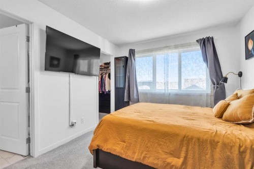 52 Edith Gate Nw, Calgary, AB - Indoor Photo Showing Bedroom