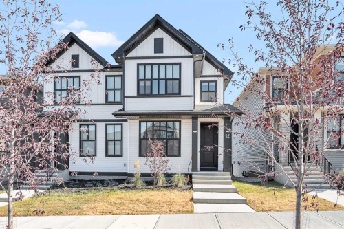 52 Edith Gate Nw, Calgary, AB - Outdoor With Facade