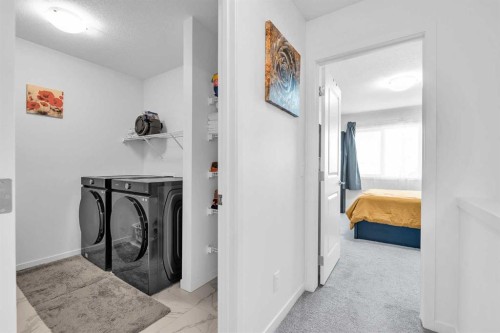 52 Edith Gate Nw, Calgary, AB - Indoor Photo Showing Laundry Room