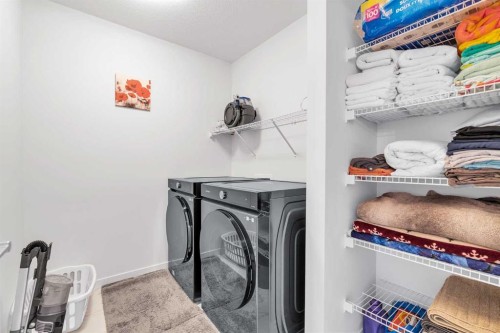 52 Edith Gate Nw, Calgary, AB - Indoor Photo Showing Laundry Room