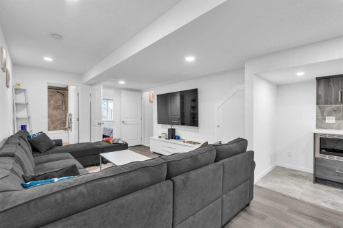 52 Edith Gate Nw, Calgary, AB - Indoor Photo Showing Living Room With Fireplace