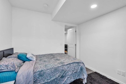 52 Edith Gate Nw, Calgary, AB - Indoor Photo Showing Bedroom